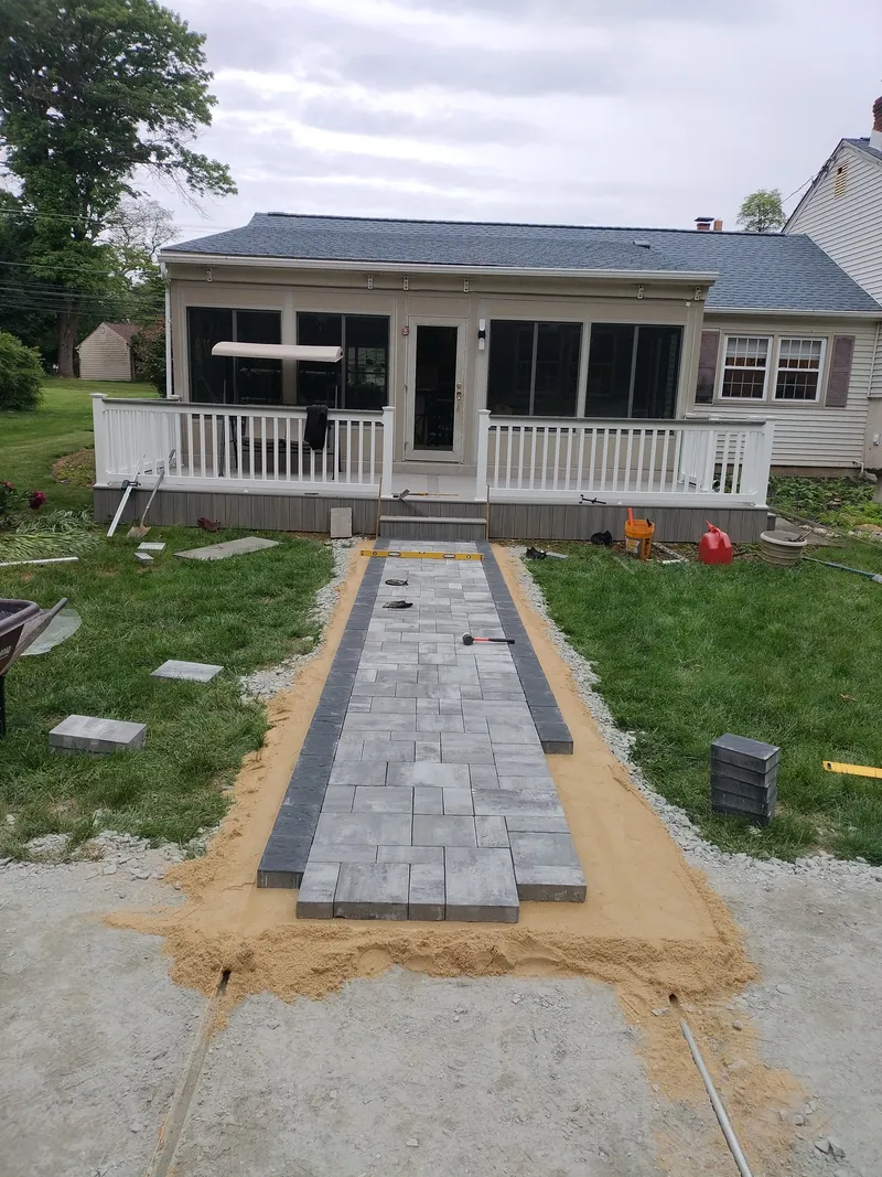 Gray Paver Walkway Construction Progress