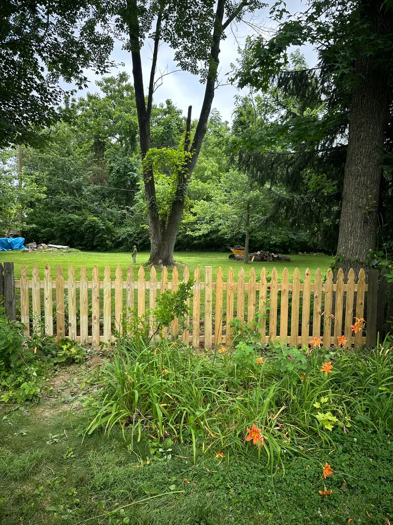 Wood Picket Fence Garden Installation